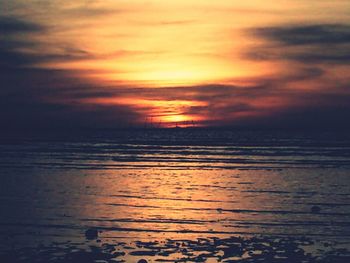 Scenic view of sea at sunset