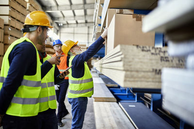 Men working in factory warehouse