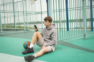 Portrait of young woman exercising in gym