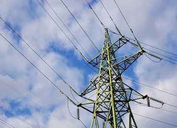 Green pylon against blue sky