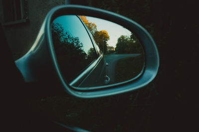 Close-up of car on road