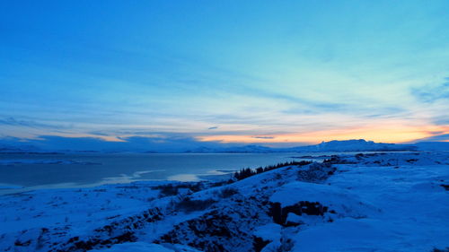 Scenic view of sea against blue sky