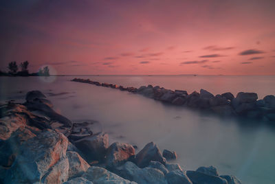 Scenic view of sea against sky during sunset