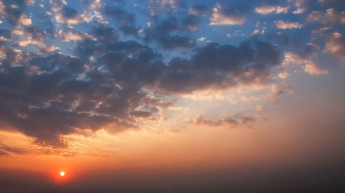 Low angle view of dramatic sky during sunset