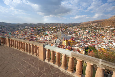 High angle view of illuminated cityscape against sky