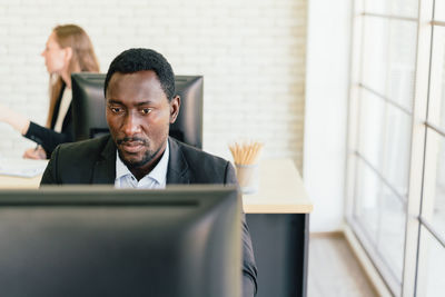 Portrait of man working in office