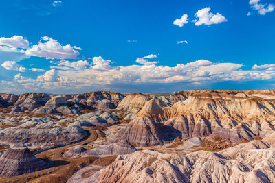 Scenic view of landscape against blue sky