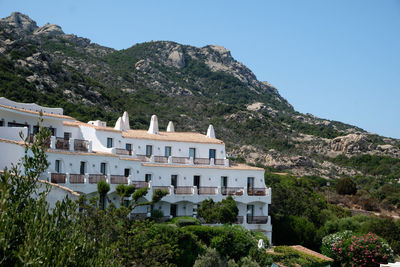 Buildings against clear blue sky