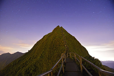 Scenic view of mountain against sky at night