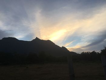 Scenic view of silhouette mountains against sky during sunset