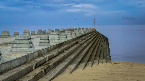 Pier over sea against sky
