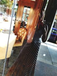 Low section of man on window