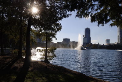 Scenic view of trees and buildings against sky