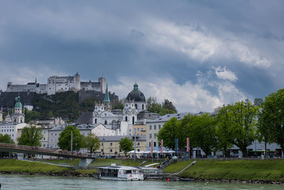 View from beach over marko-feingold-steg and hohensalzburg