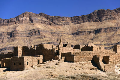 Panoramic view of buildings against mountain range