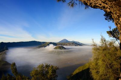 View of volcanic mountain against blue sky