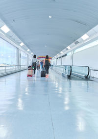 People walking on escalator