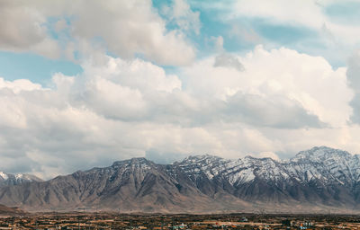 Scenic view of snowcapped mountains against sky