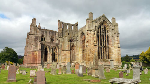 View of cemetery against cloudy sky