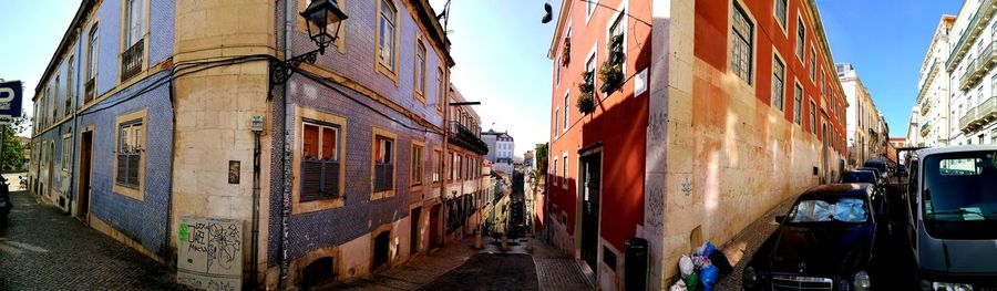 Panoramic view of street amidst buildings in city