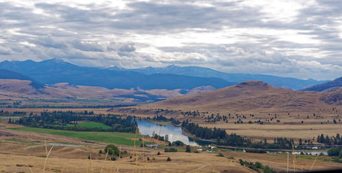 Scenic view of landscape and mountains against sky