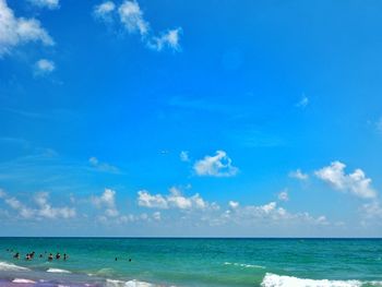 Scenic view of sea against blue sky