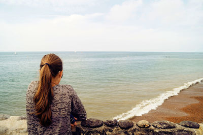 Girl looking at beach