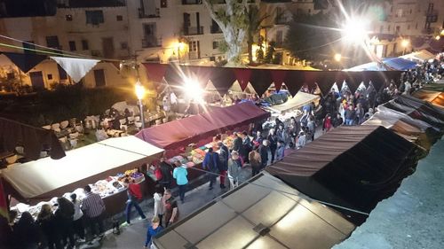 People on city street at night