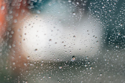 Full frame shot of wet glass window