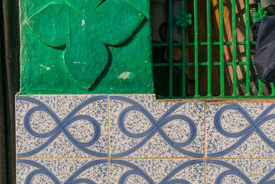 Close-up of metal railing against building