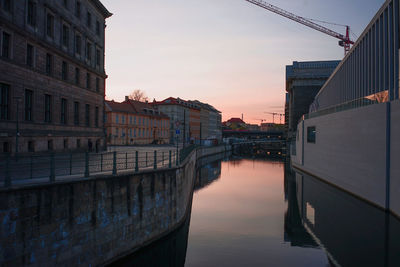  embankment of river spree and    buildings against sky during sunset at museum island, berlin