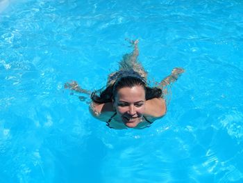 Portrait of man swimming in pool