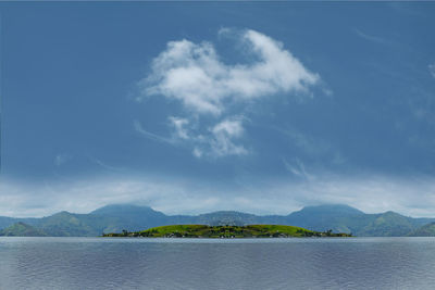 Scenic view of lake against blue sky