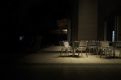 Empty chairs and table in room