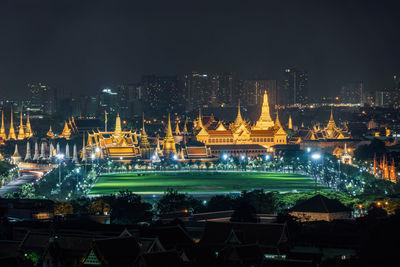 Illuminated buildings in city at night