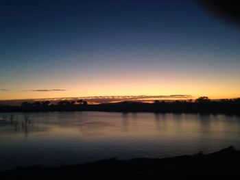 Scenic view of lake at sunset