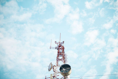 Low angle view of communications tower against sky