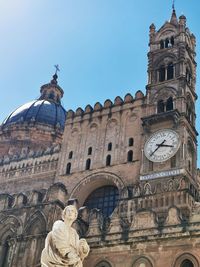 Low angle view of statue of historic building