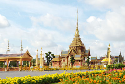 View of temple building against cloudy sky