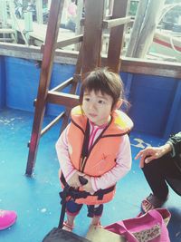 Girl playing in swimming pool at playground