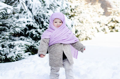 Full length of cute girl in snow