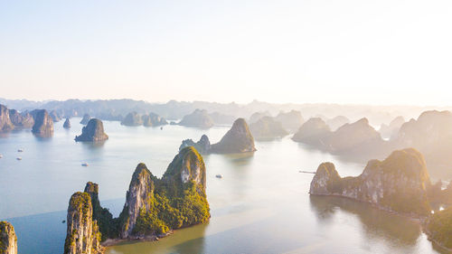 Panoramic shot of rocks in sea against clear sky