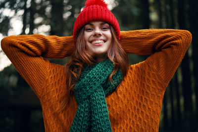 Portrait of smiling young woman in winter