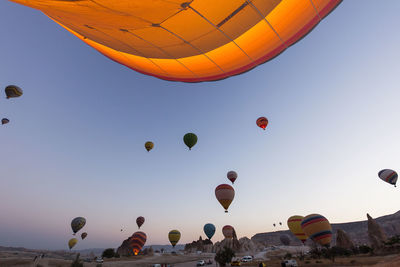 Low angle view of hot air balloons against sky