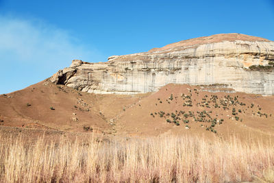 Rock formations in desert against sky