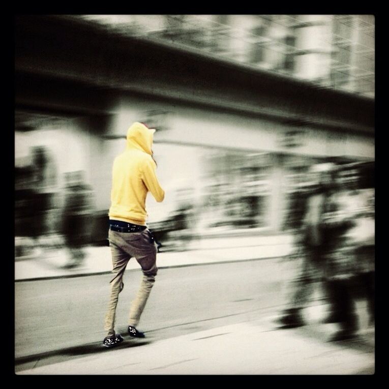 transportation, mode of transport, on the move, public transportation, rear view, blurred motion, walking, motion, railroad station platform, full length, travel, men, city life, railroad station, lifestyles, person, land vehicle, street