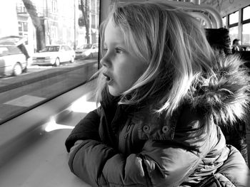 Close-up of young woman in bus