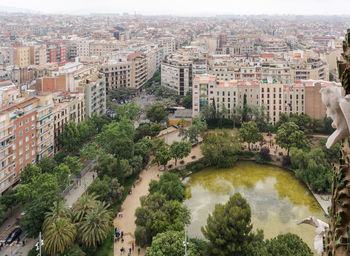 View to barcelona from the top of the basilica, with the green pond on the plaza de gaudi