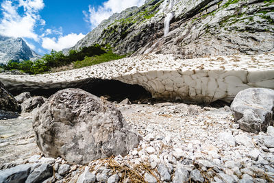 Rocks in mountains against sky