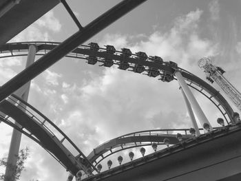 Low angle view of rollercoaster against sky